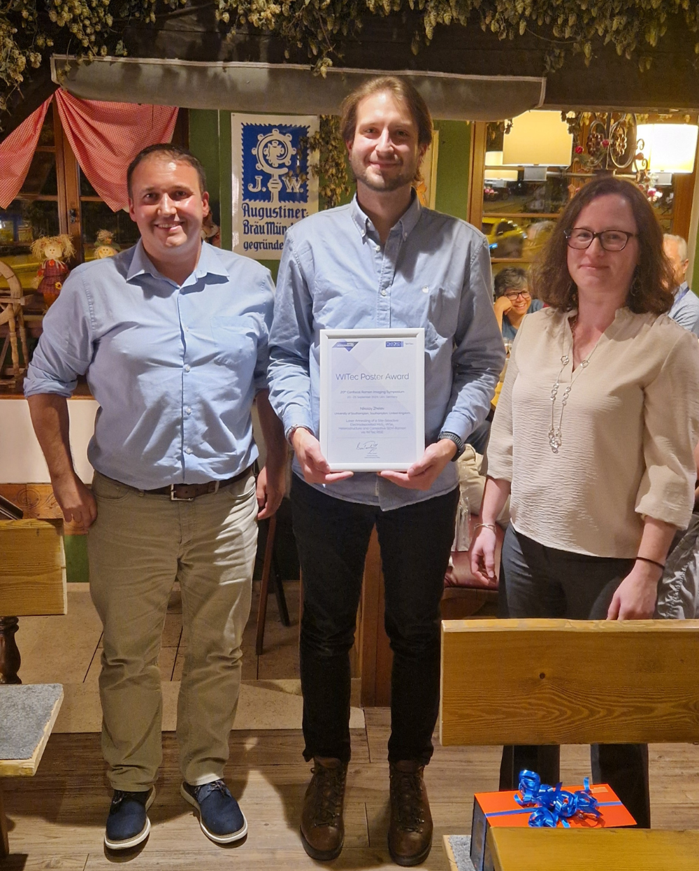 Presentation of the Poster Award (L to R): Oxford Instruments WITec Managing Director Dr. Benjamin Tordoff, Winner Dr. Nikolay Zhelev, Oxford Instruments WITec Head of Applications Dr. Miriam Böhmler